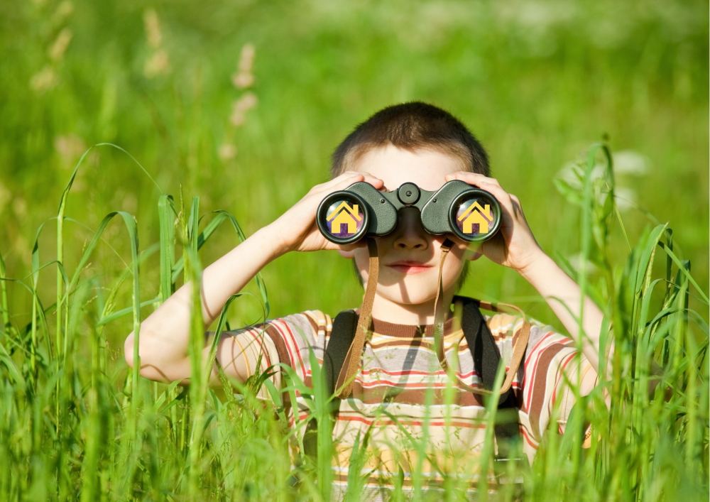 Boy Looking Through Binculars