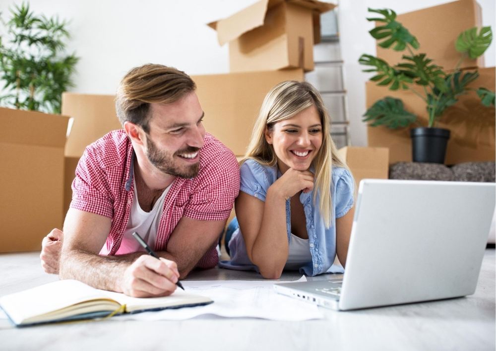 A couple looking at Home Design plans