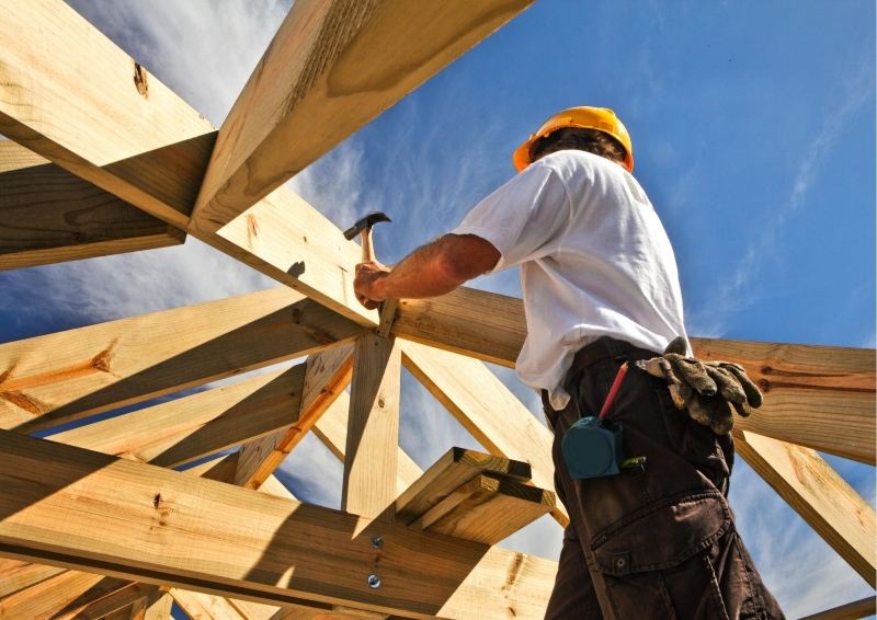 Person nailing a House frame together In the Hunter Valley