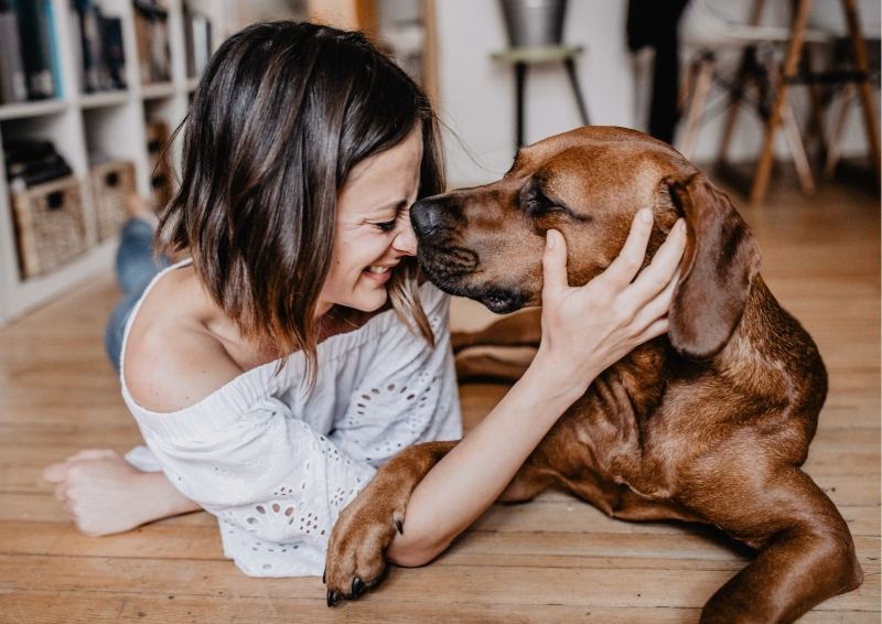 Lady with dog on new floor in a new project home