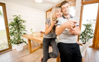 Happy couple in home with natural light