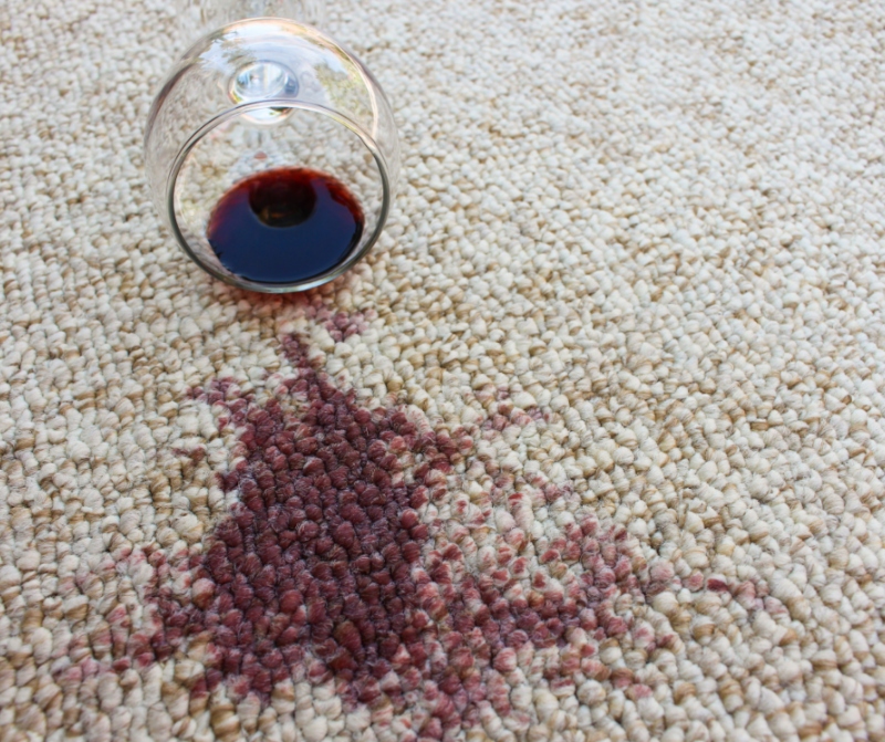 Red wine spilt on carpet