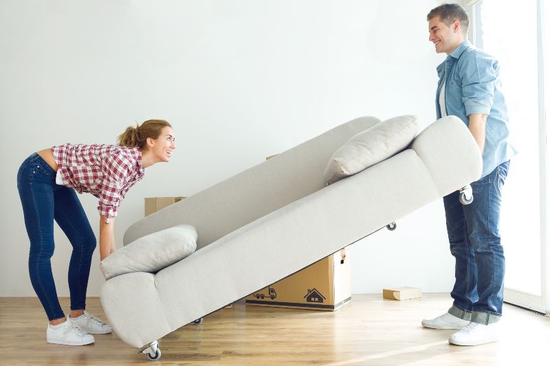 couple moving a couch