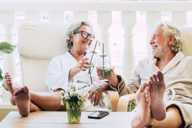 Elderly couple enjoying a drink