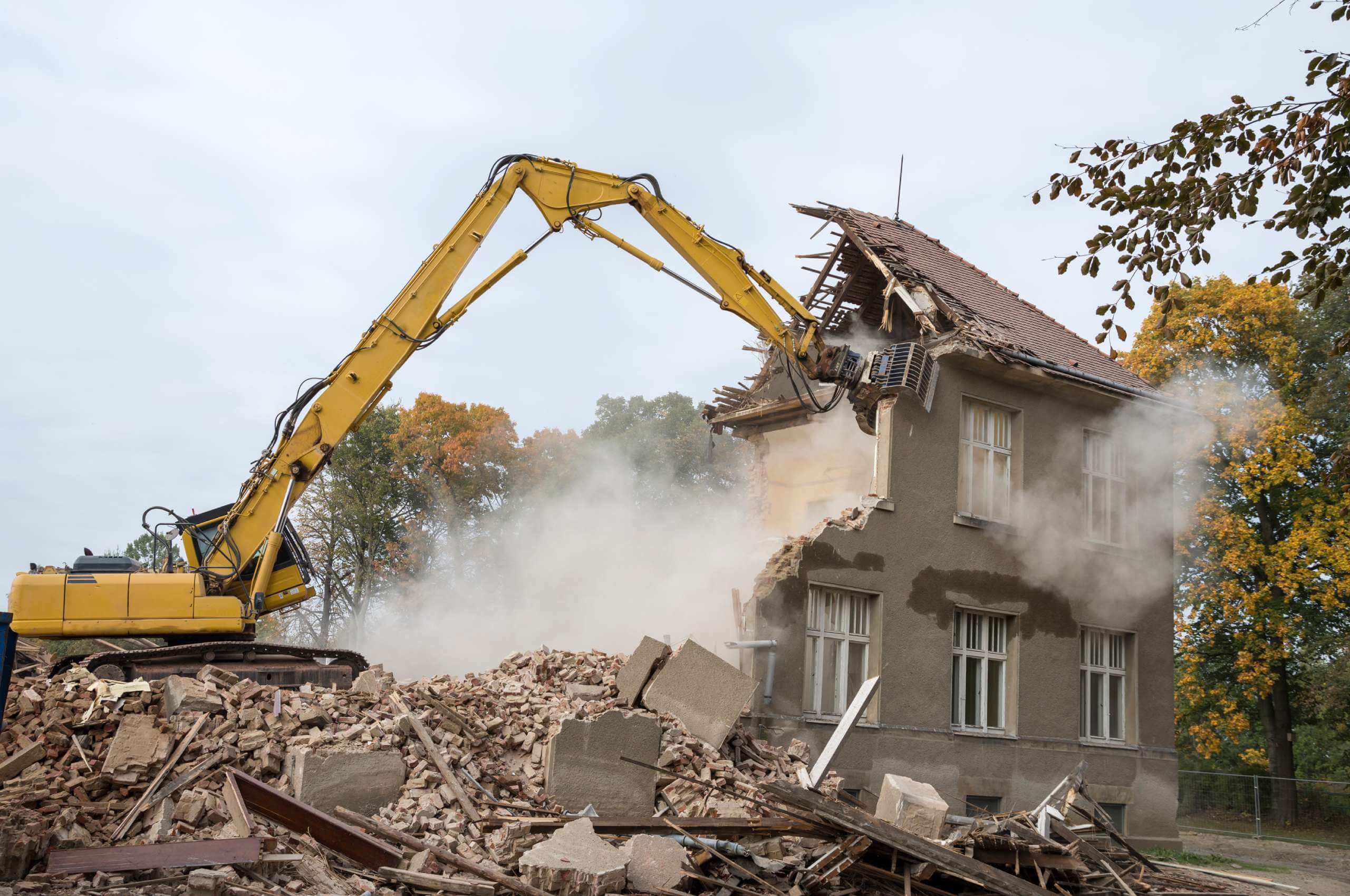 home being knocked down by excavator