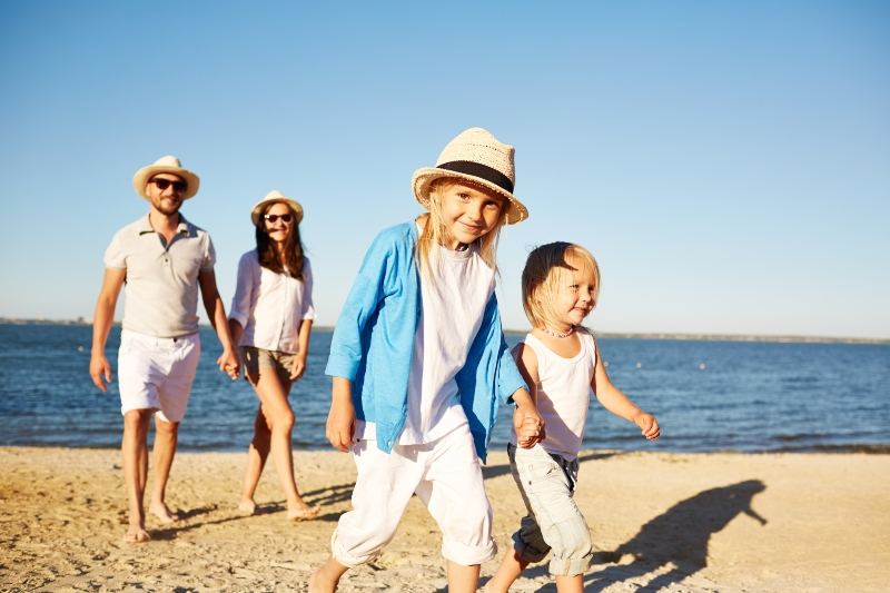 Family walking on a beach