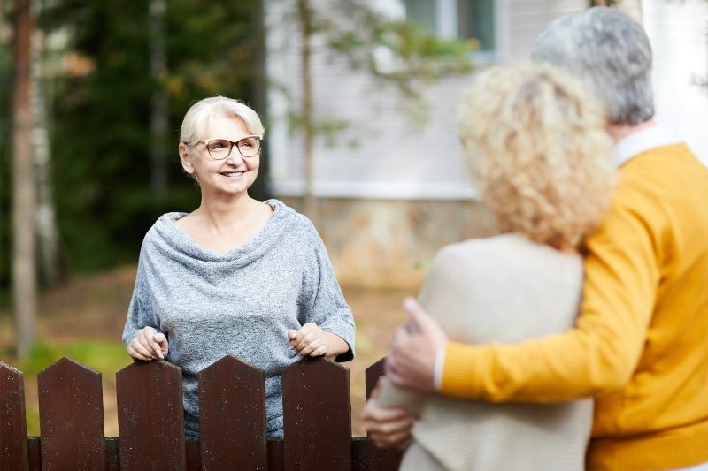 Couple talking to neighbour